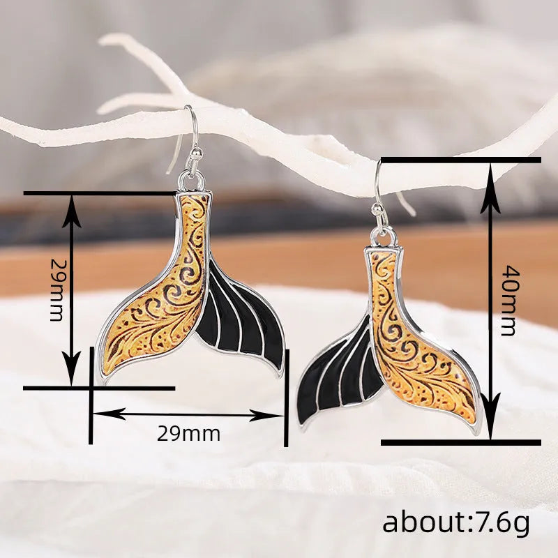 Women's retro fishtail and whale design alloy earrings in white gold colour E4143.
