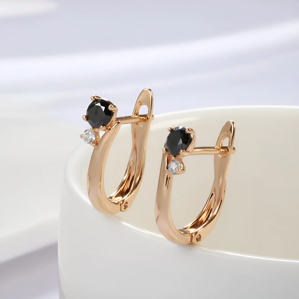 Gold drop earrings with black agate stones in geometric retro design for women