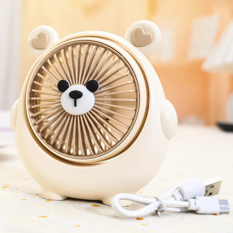 Dog-shaped desktop USB fan showing colour options including brown bear and pink puppy variants