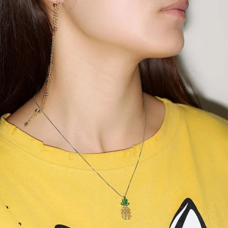 Silver-plated geometric pineapple pendant necklace on model