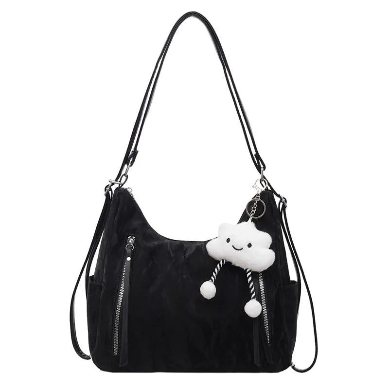 Women's soft PU backpack in neutral colours with pendant accessory