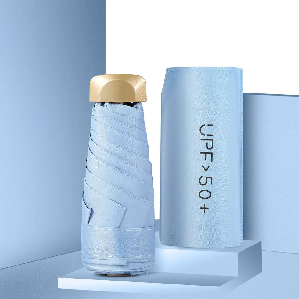 Closed five-fold compact sun umbrella with a rubber handle, shown in one of eleven available colours.