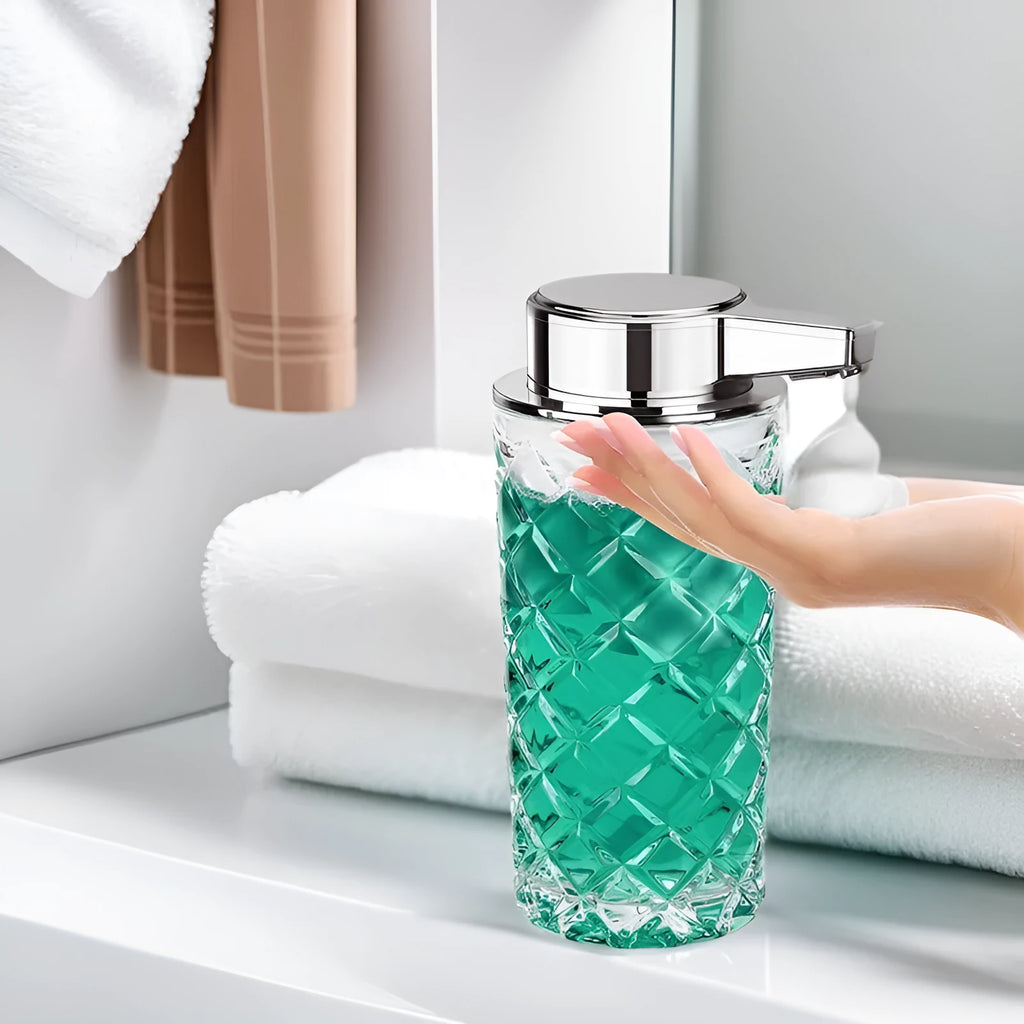 Silver automatic sensor soap dispenser with type-c charging port on a bathroom countertop.
