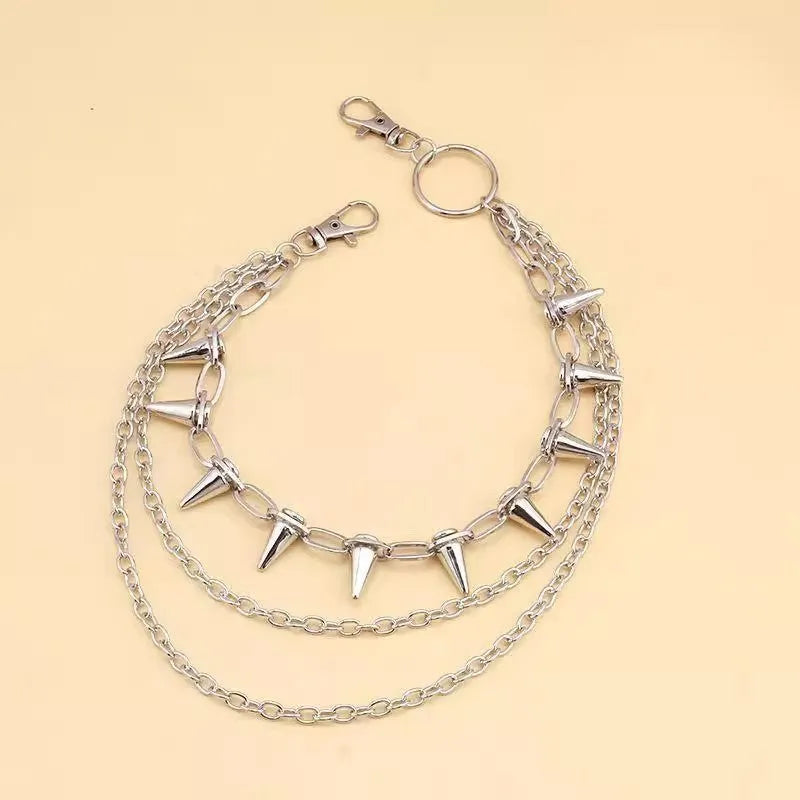 Silver alloy trousers chain with double layer design and rivet detailing, shown against dark fabric