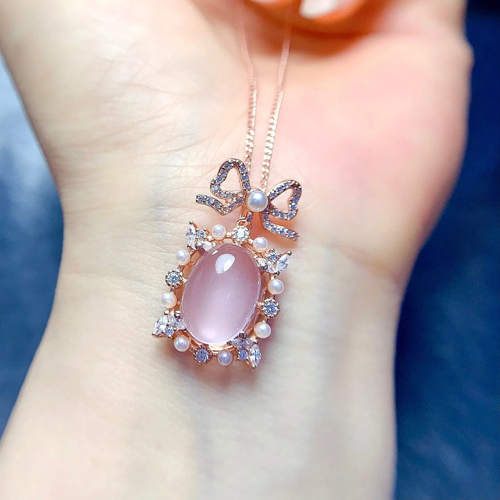 Geometric rose quartz pendant on a rose gold plated silver chain.