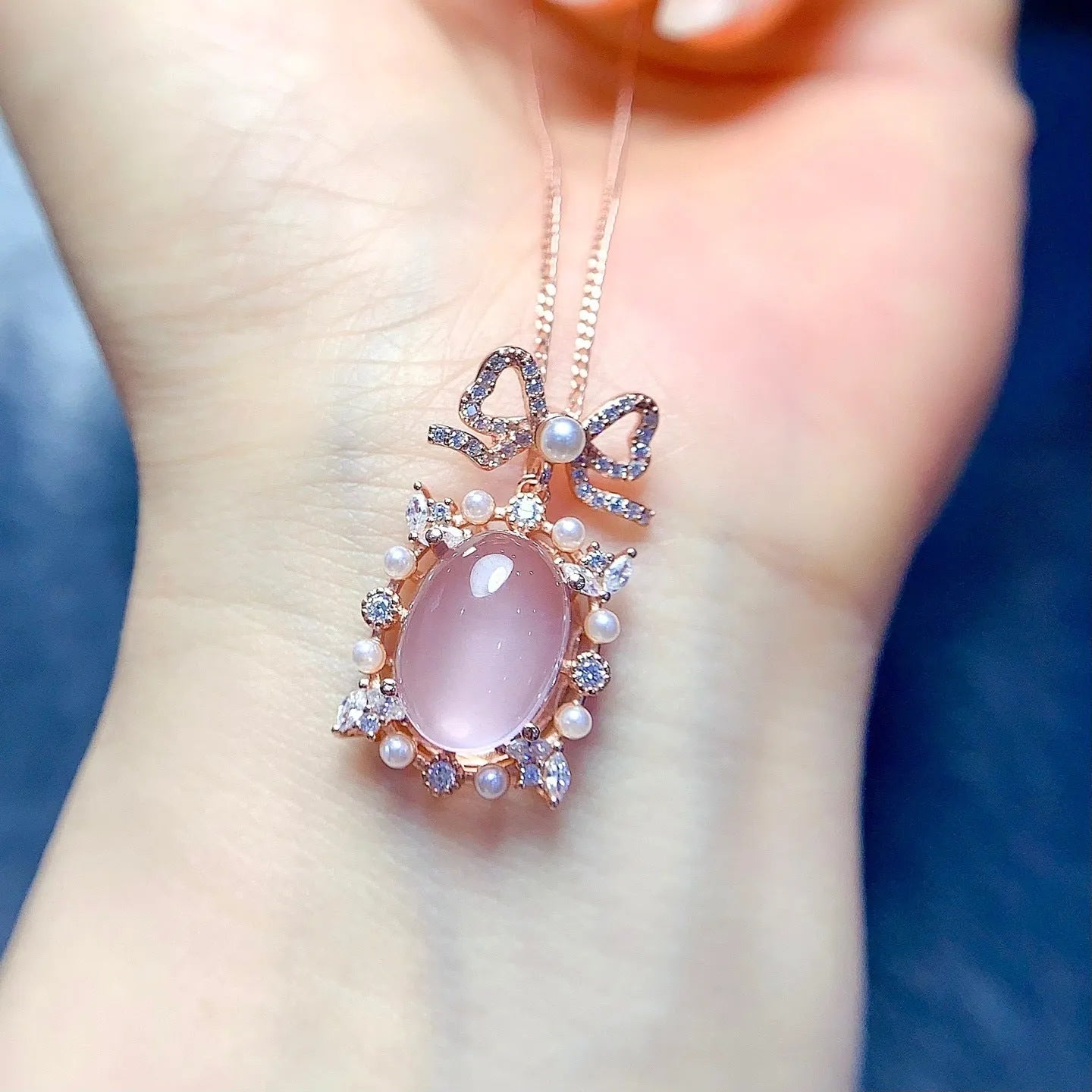 Geometric rose quartz pendant on a rose gold plated silver chain.