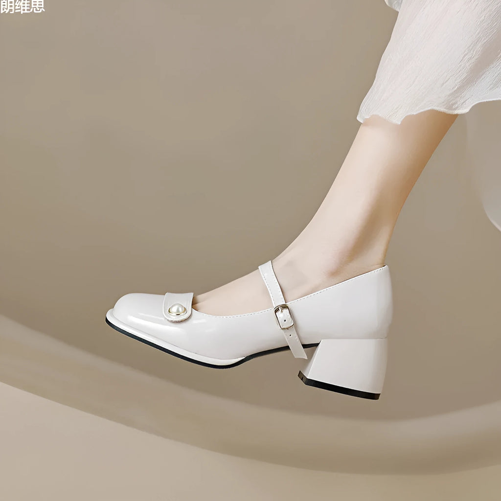Womens mid-top patent leather ankle boots with a square toe and chunky block heel in apricot colour.