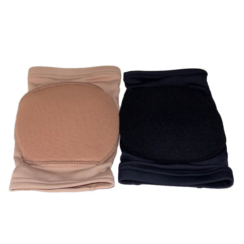 A pair of black knee pads for ballet dance and yoga exercise on a grey background.