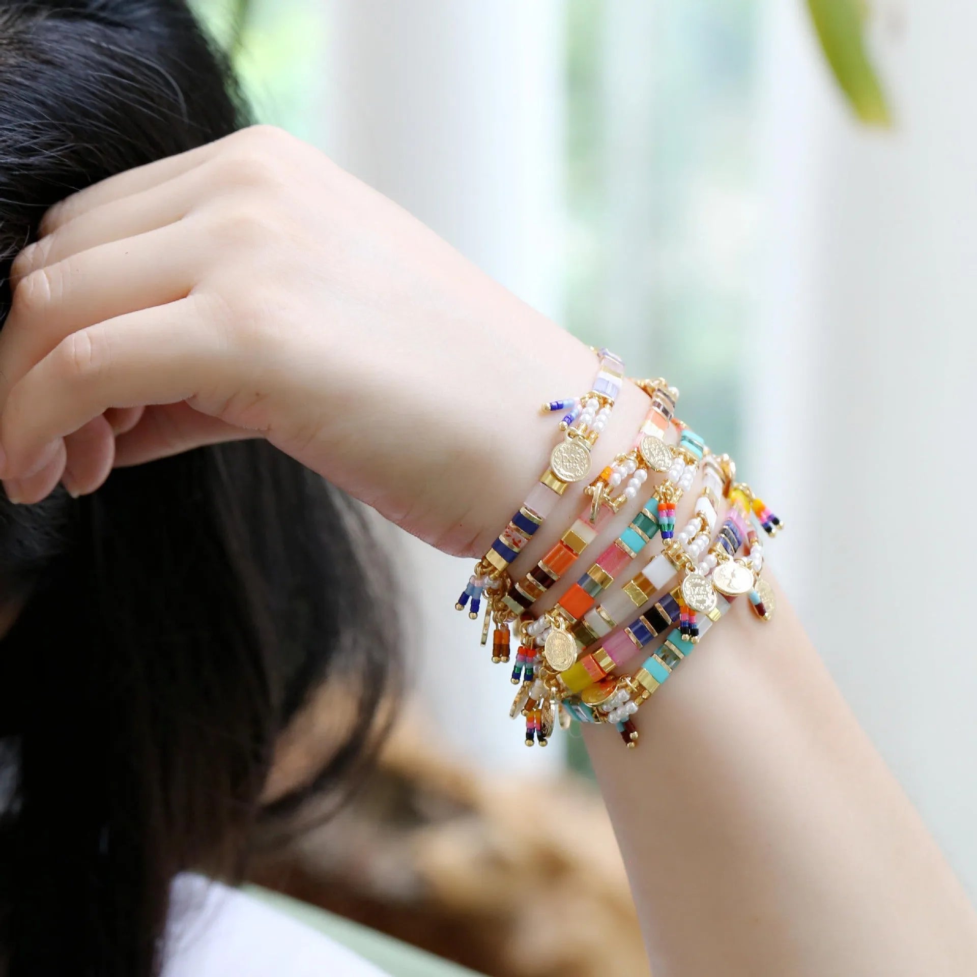 Women's handcrafted imitation pearl beaded bracelet showing European American styling