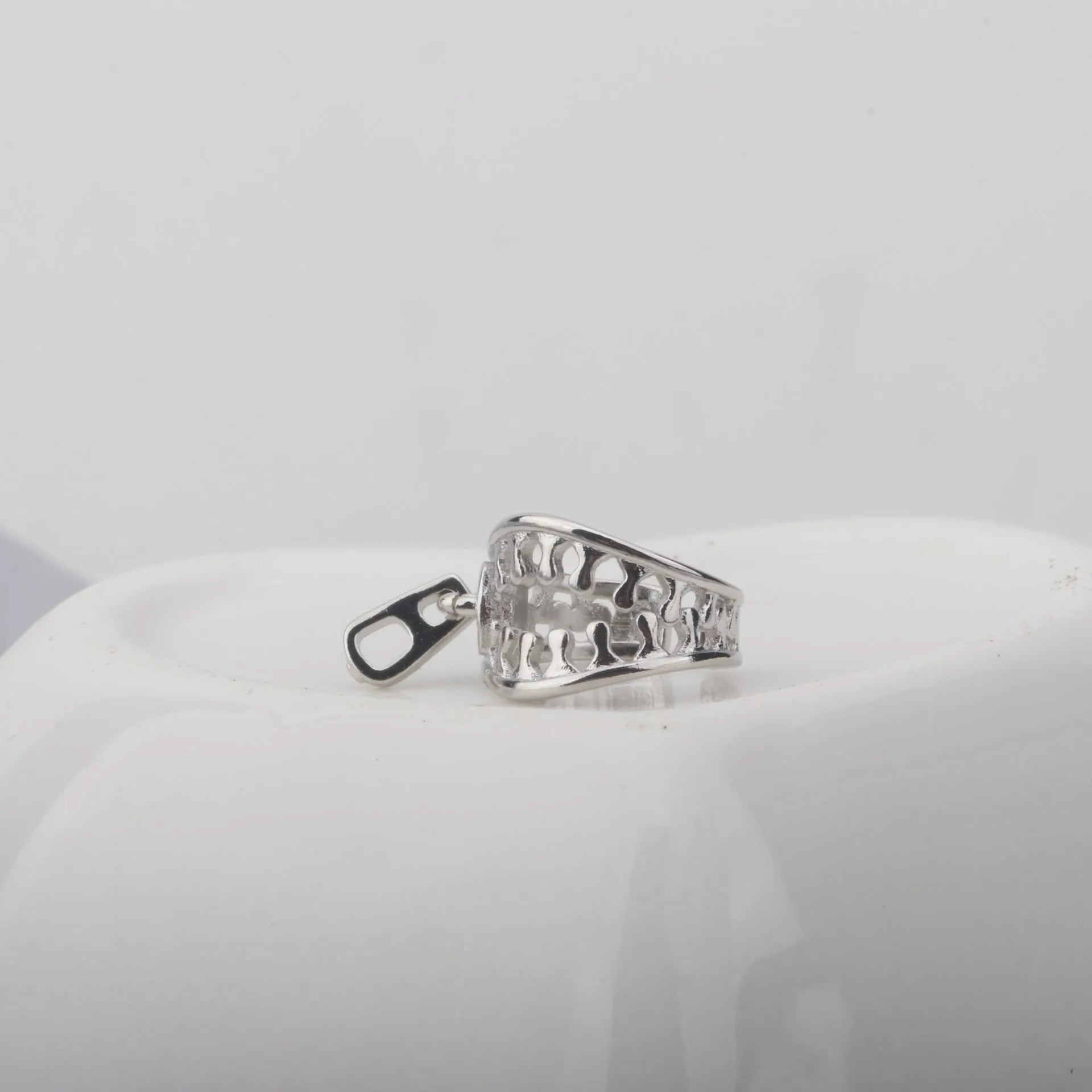 Copper geometric clip-on earrings with a simple zipper ear bone clip design in colour ES862.