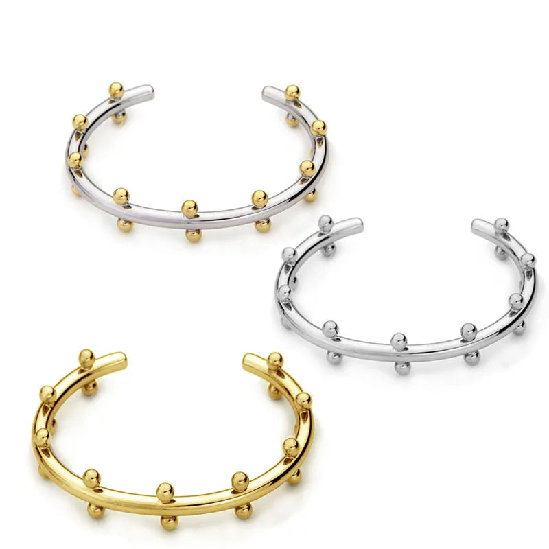 Stainless steel C-shaped texture beads with rivet design in gold, steel, and steel gold finishes