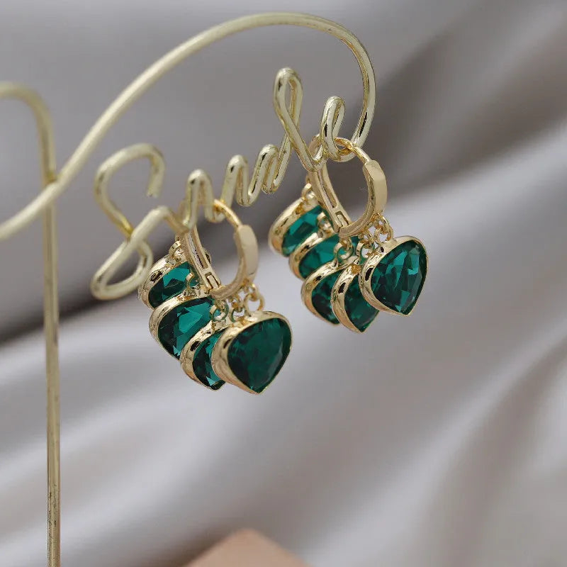 Green glass heart pendant ear clip earrings in Korean style with copper alloy construction