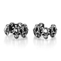 Stainless steel skull earrings with hollow geometric design and ear clip closure