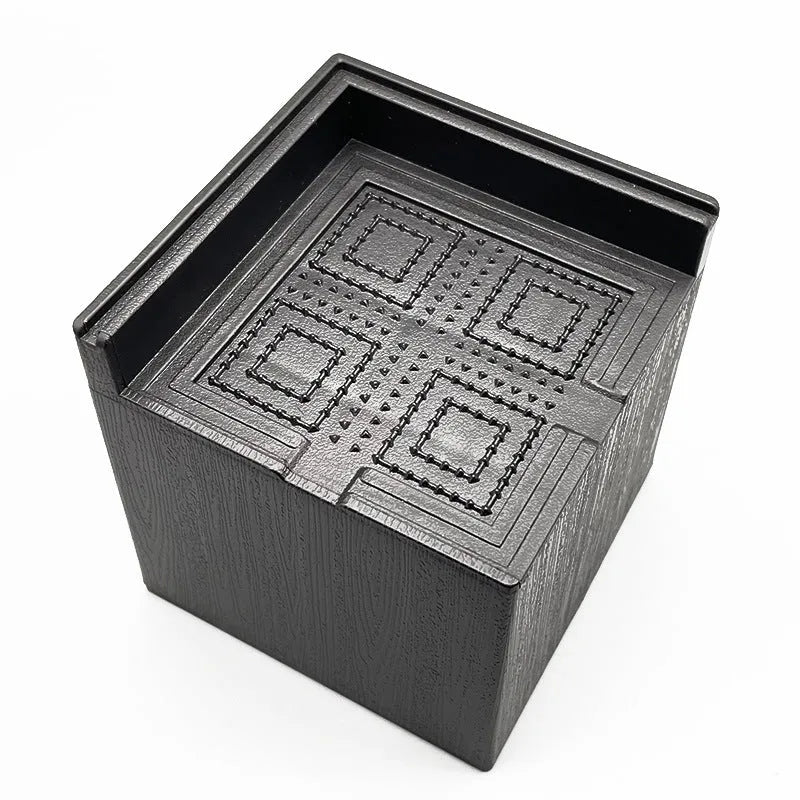 Four black plastic furniture foot mats for bed and sofa height adjustment