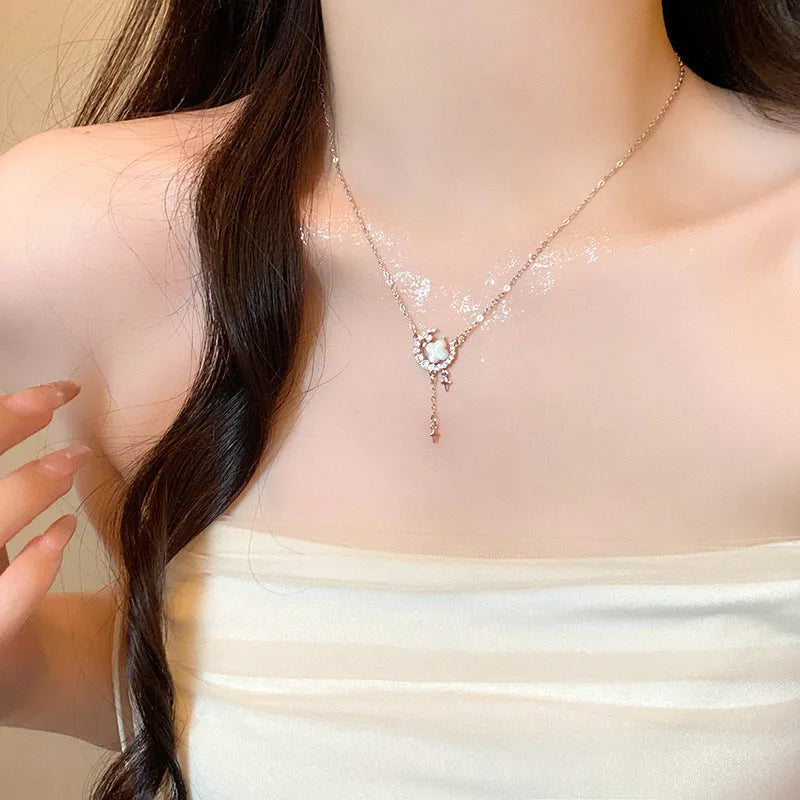 Gold star moon zirconium necklace on adjustable copper chain with celestial pendant design