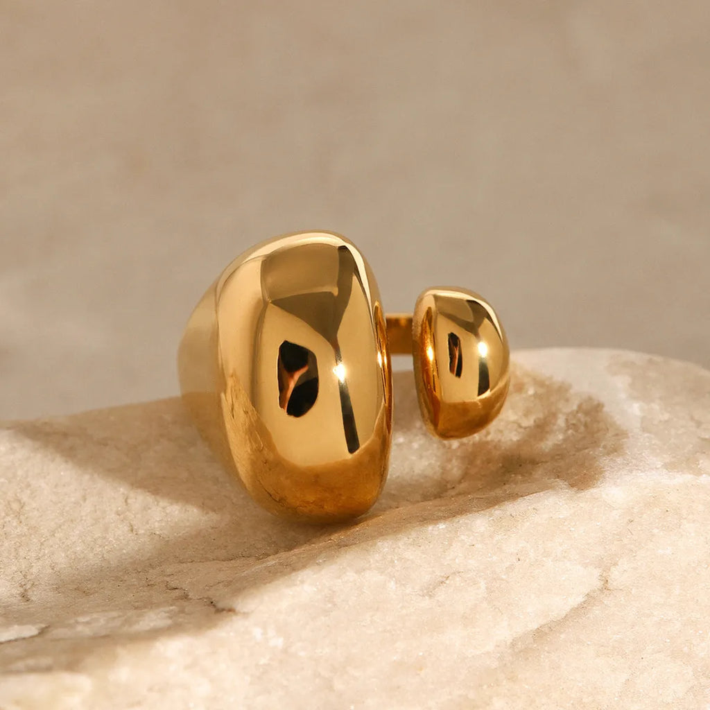 Women's exaggerated geometric open ring in stainless steel with electroplated finish.