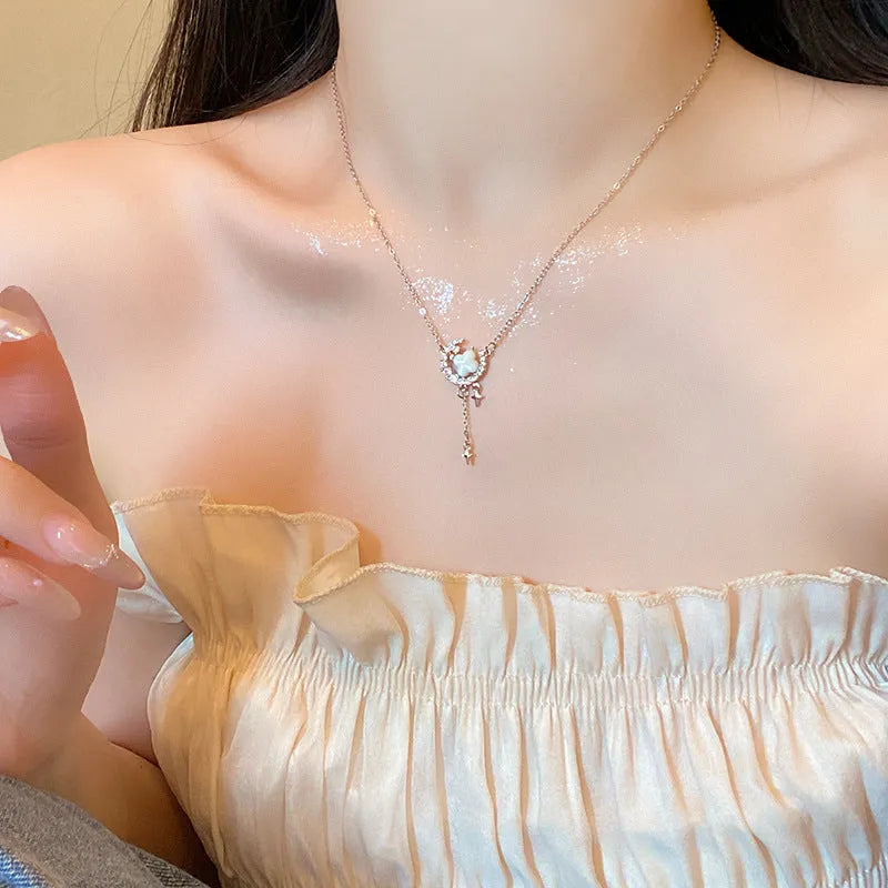 Gold star moon zirconium necklace on adjustable copper chain with celestial pendant design