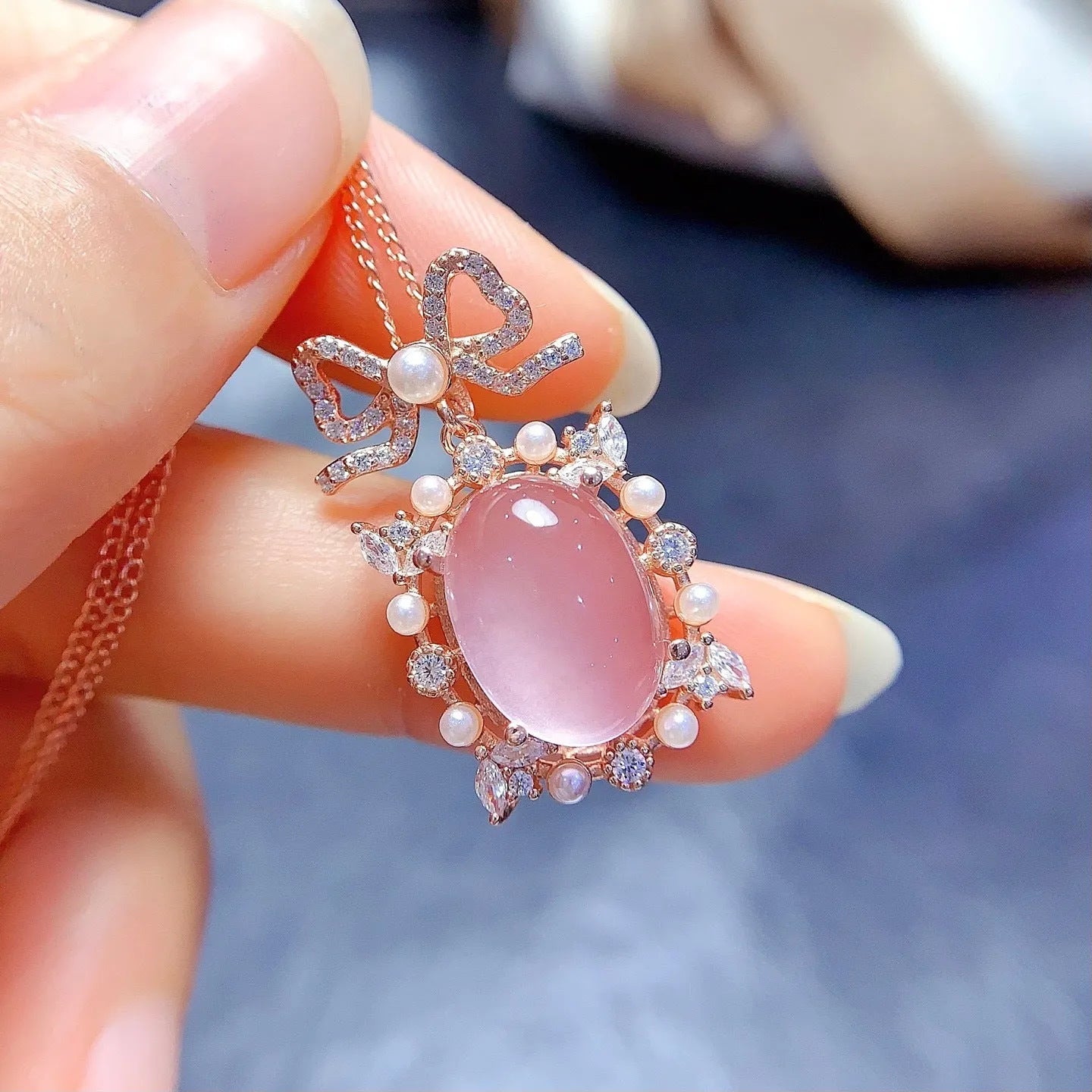 Geometric rose quartz pendant on a rose gold plated silver chain.