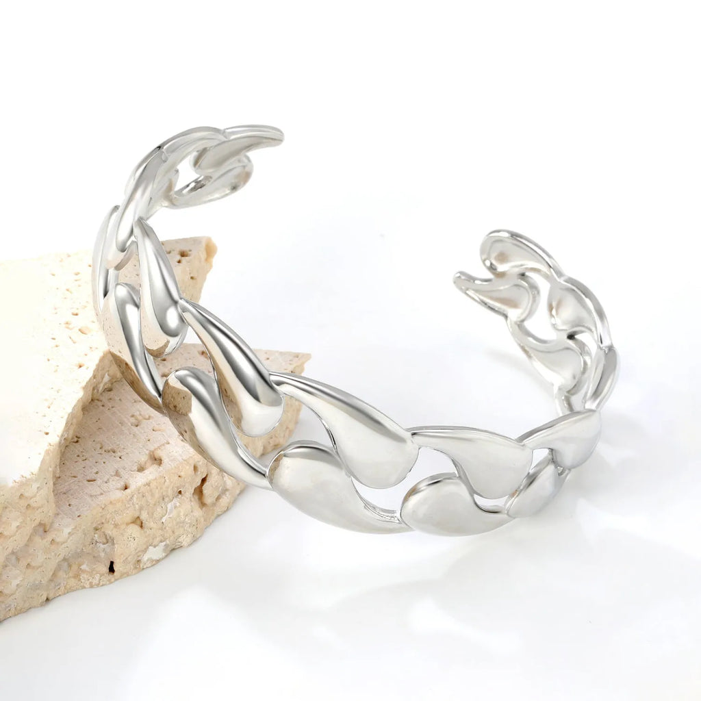 Modern stainless steel alloy bracelet on a wrist, shown in one of three available colour finishes.