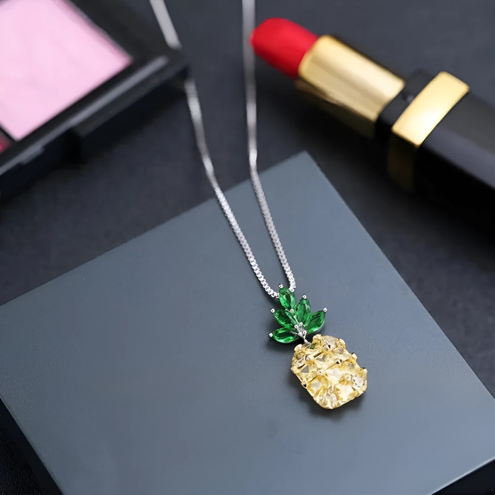 Silver-plated geometric pineapple pendant necklace on model