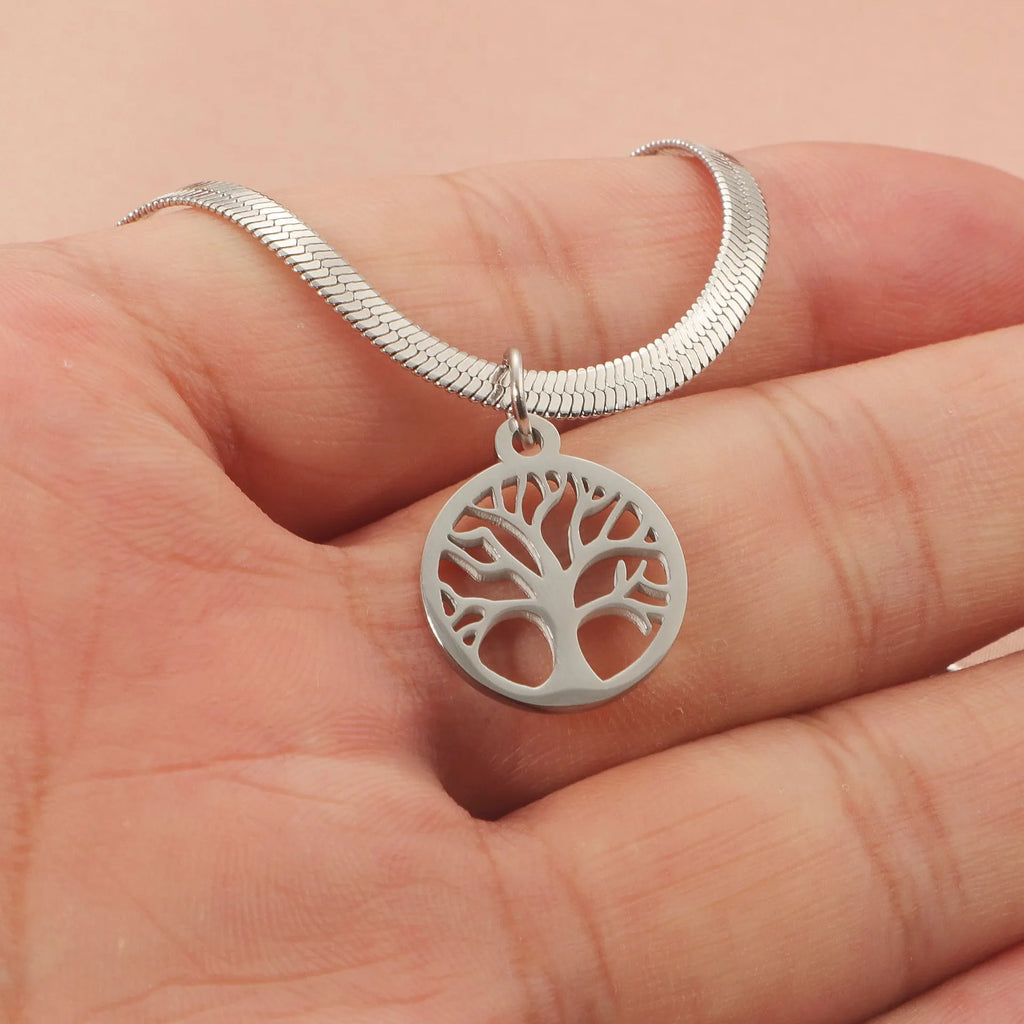 Stainless steel lucky tree pendant necklace on a snake bones chain, shown in gold and steel colour options.