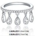 Silver moissanite tassel ring with crown shape, round element, US sizes 5 to 9