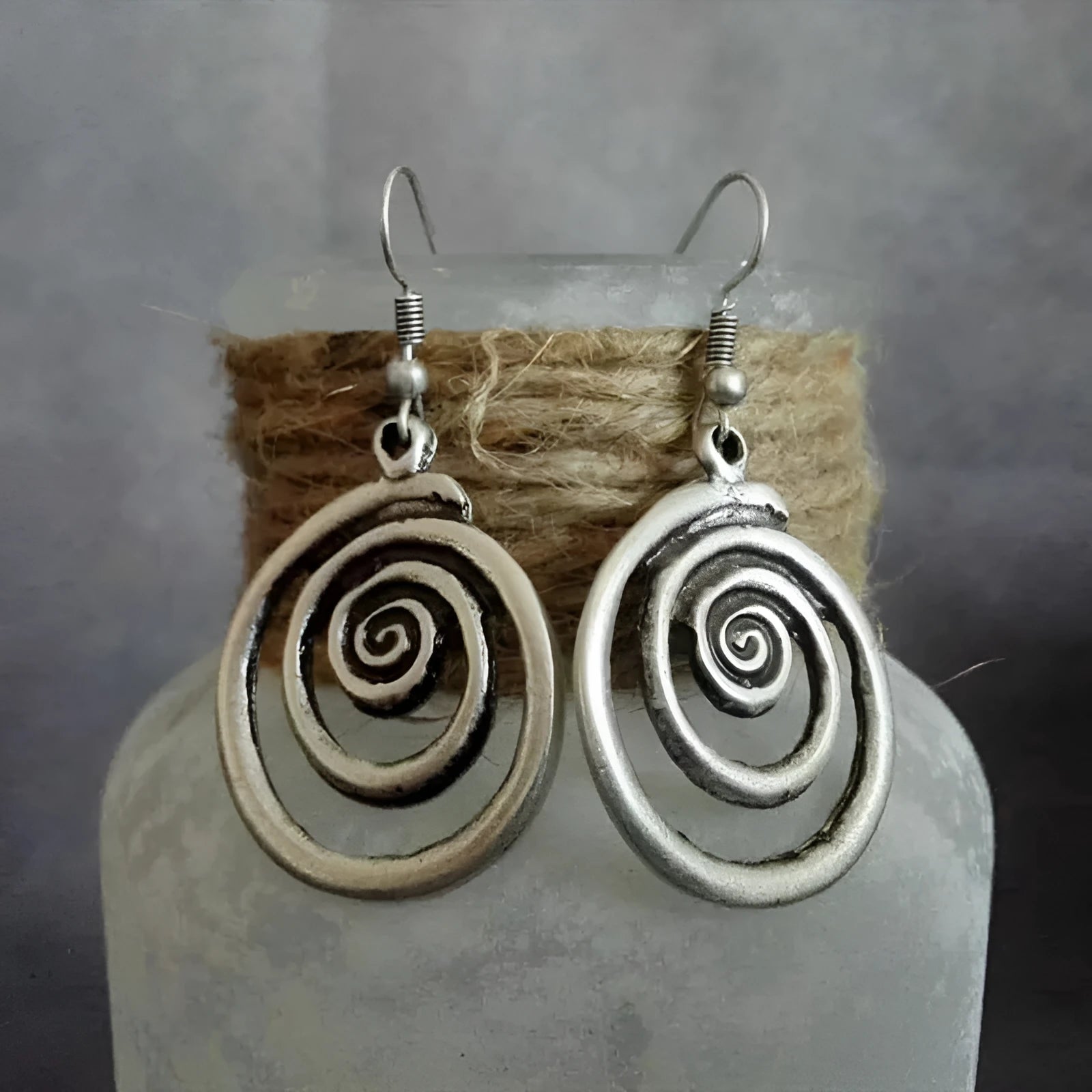 Geometric spiral earrings with distressed silver finish and national style details