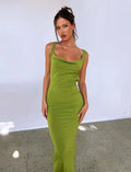 Backless milk silk sling dress in champagne colour on a model, showing slim fit and spaghetti straps.