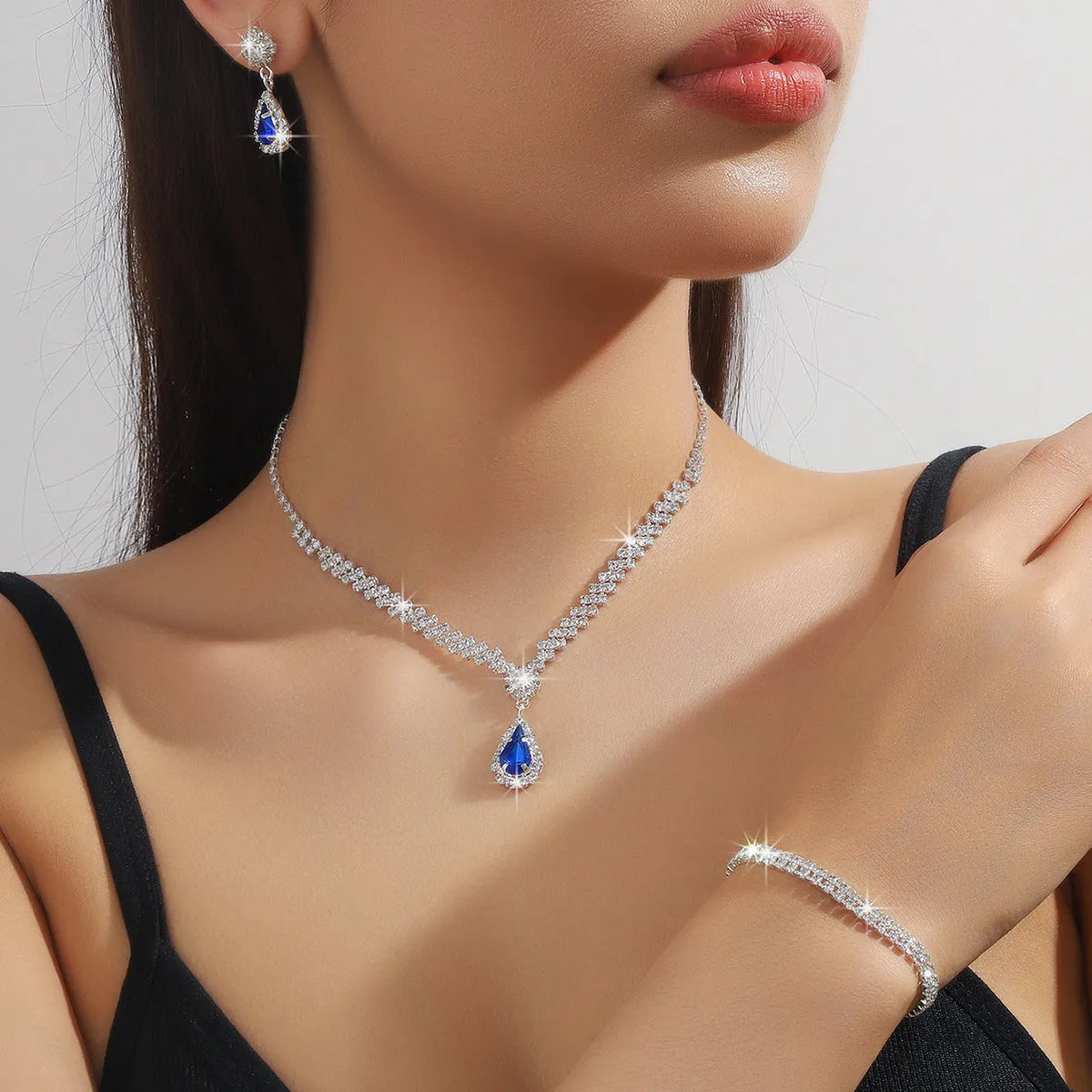 Claw chain necklace and earrings set with water drop rhinestones in multiple colour options