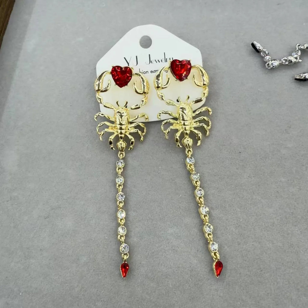 Exaggerated facial features asymmetric earrings for women in gold, alloy electroplated insect style