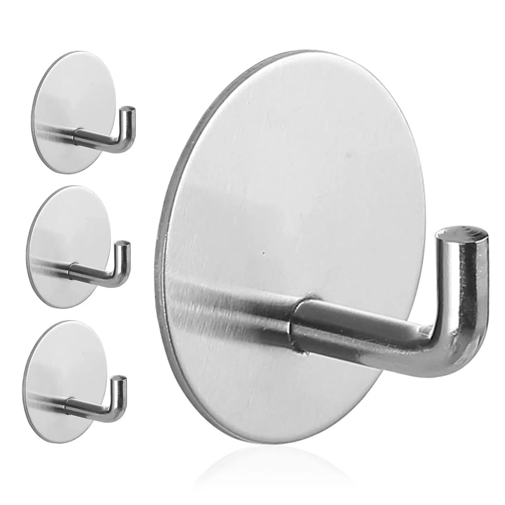 Stainless steel self-adhesive single hook for wall mounting in black and sanded finishes.