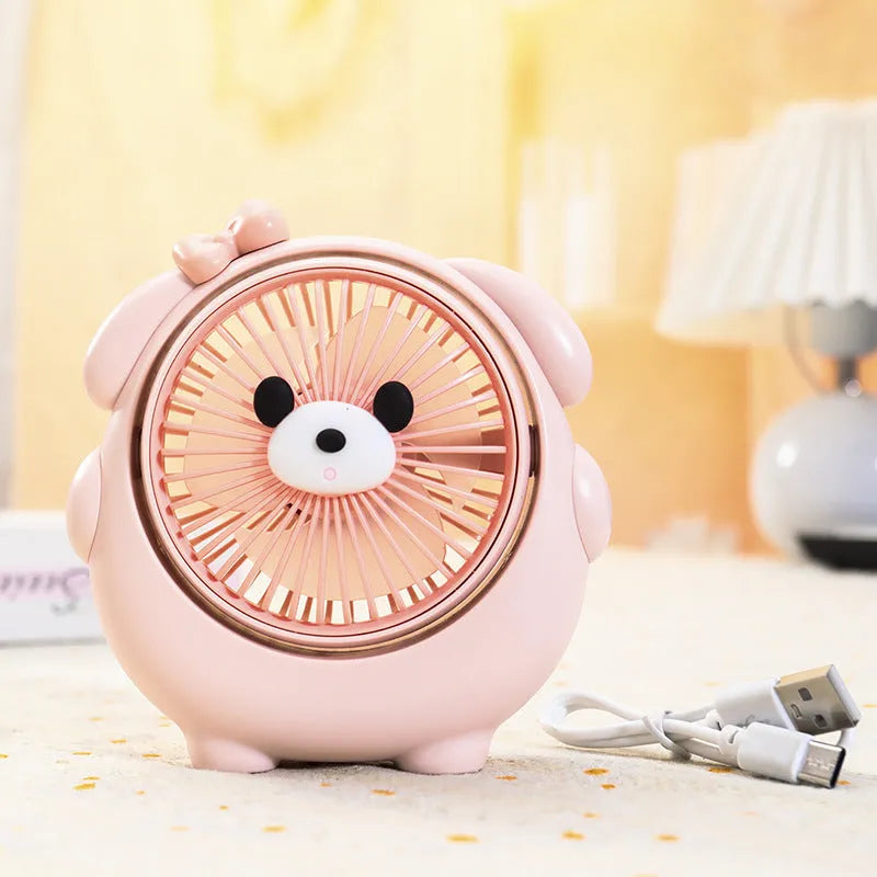Dog-themed USB desktop electric fan in one of six colour options on a desk.