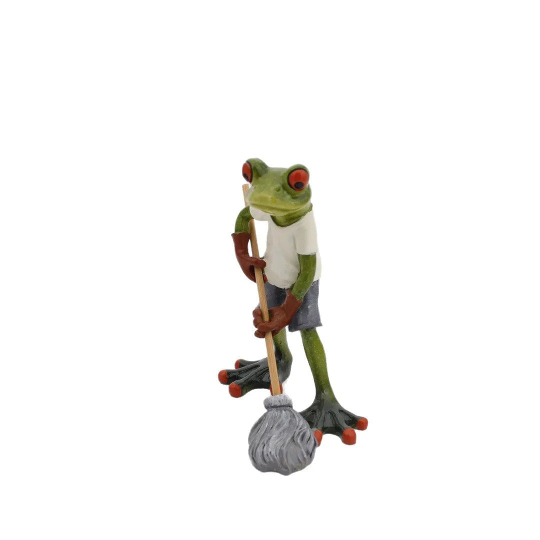 Pastoral style synthetic resin frog ornament for home decoration on a wooden shelf.