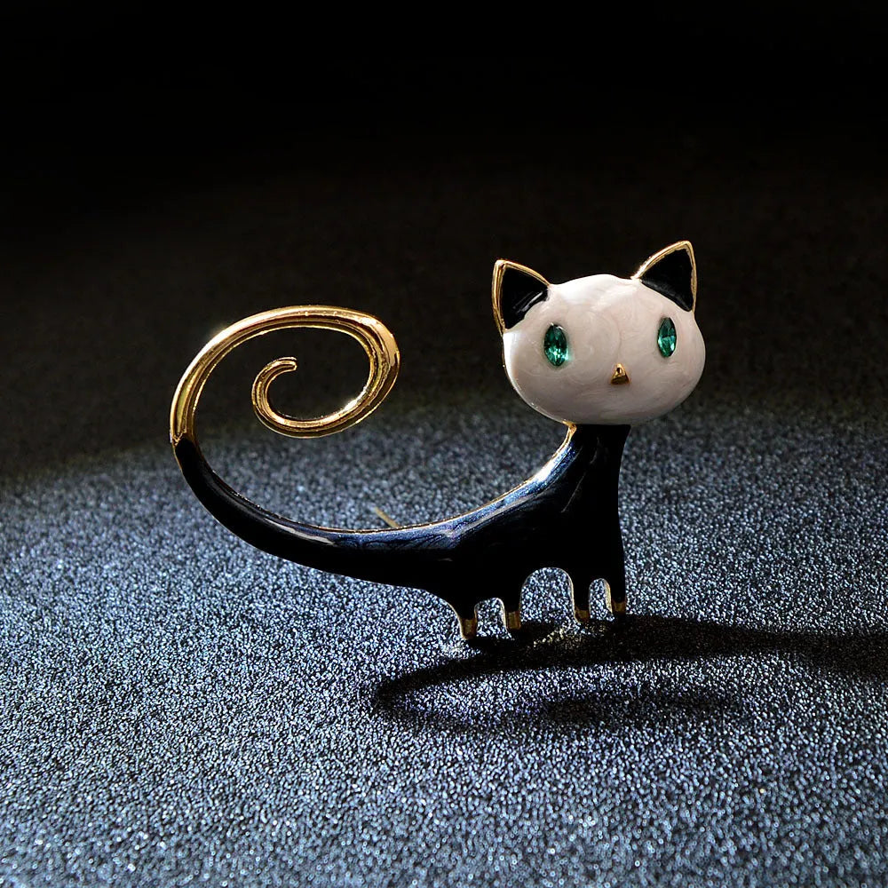 Personalised painted alloy brooch showing a cat design with raised tail, in orange and white colour options