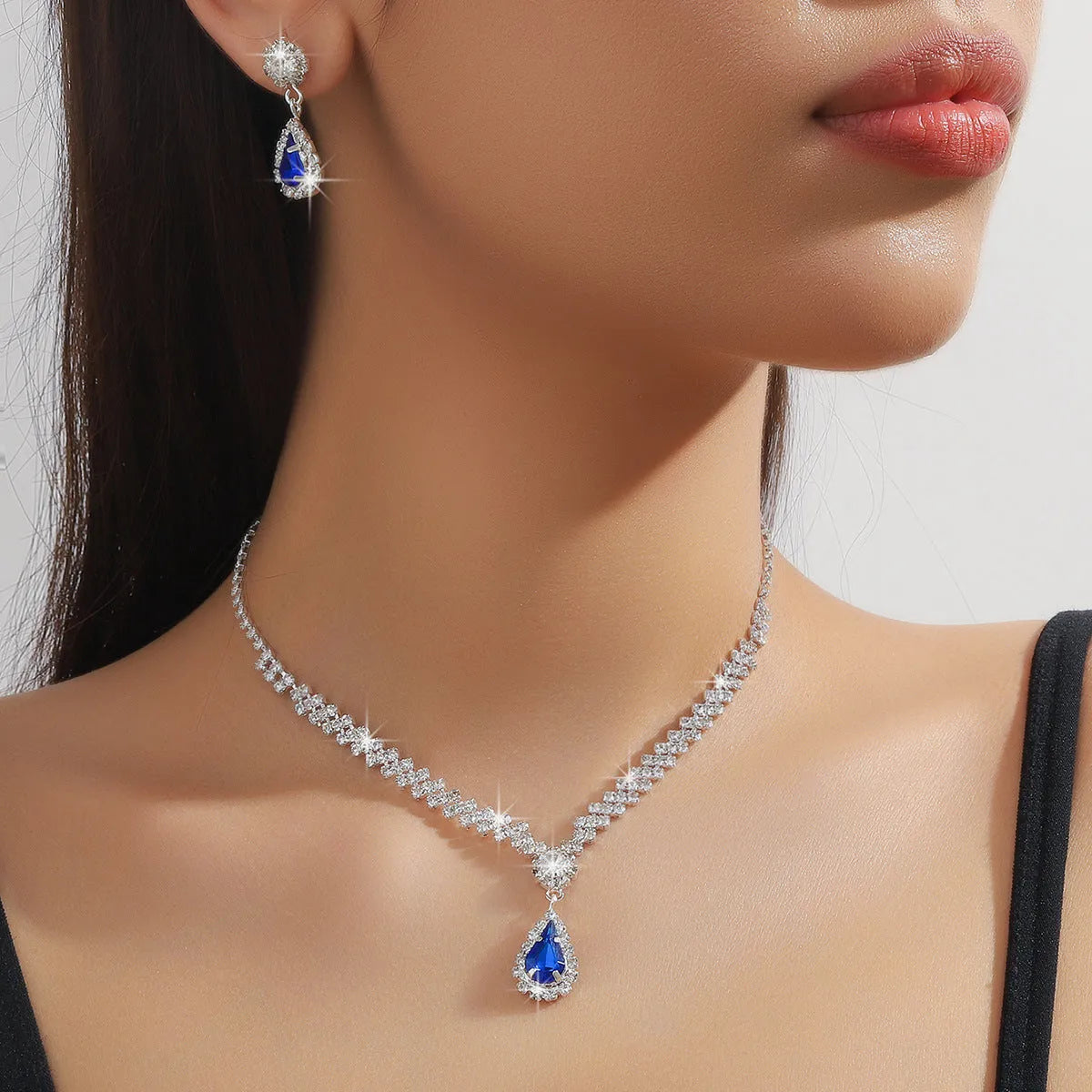 Claw chain necklace and earrings set with water drop rhinestones in multiple colour options