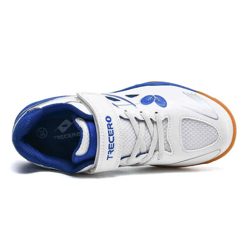 White and blue low-top PVC badminton shoes with round toe and ribbed sole.