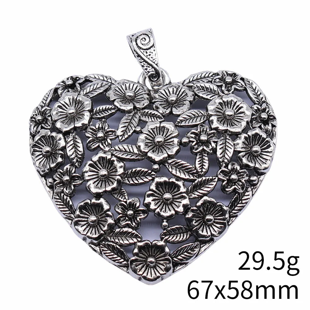 Ancient silver hollow flower love pendant measuring 67mm by 58mm with electroplated finish