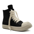 Black high-top leather shoes with a side zip and round toe on a rubber sole.