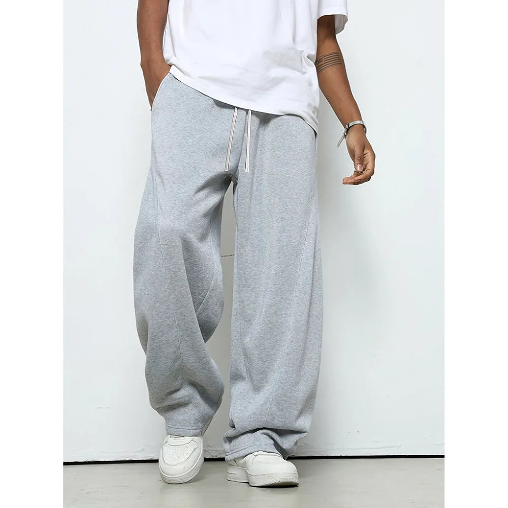Men's straight leg casual trousers with a drawstring waist in black, dark grey, or light grey.
