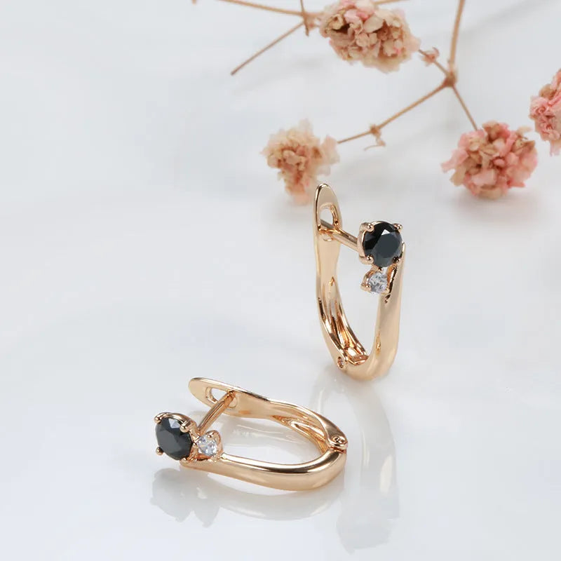 Gold drop earrings with black agate stones in geometric retro design for women