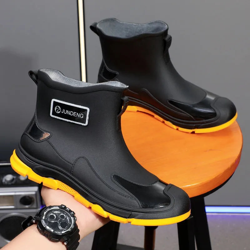 Short tube PVC waterproof boots in black, black and yellow, or khaki with flat heel and round toe.
