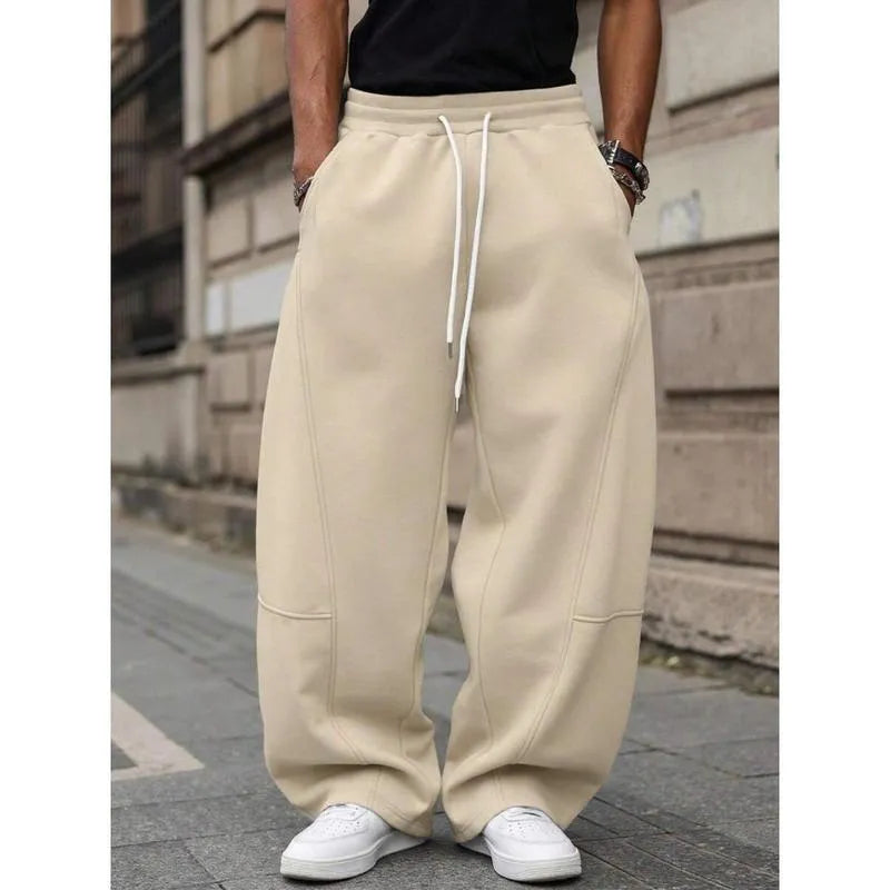 Man wearing dark grey high-waisted straight-leg cropped casual trousers made from bamboo fibre.