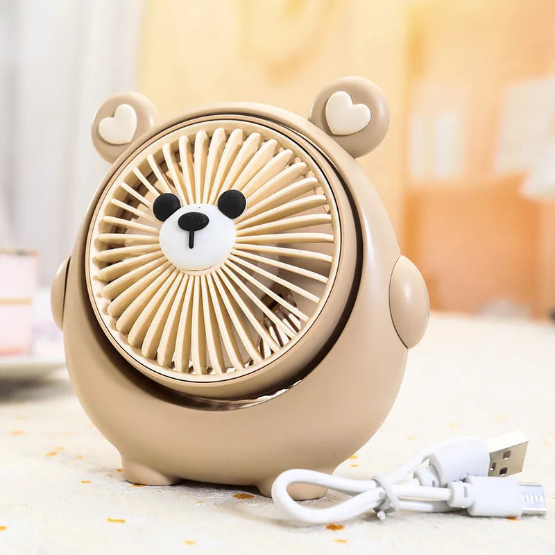 Dog-shaped desktop USB fan showing colour options including brown bear and pink puppy variants