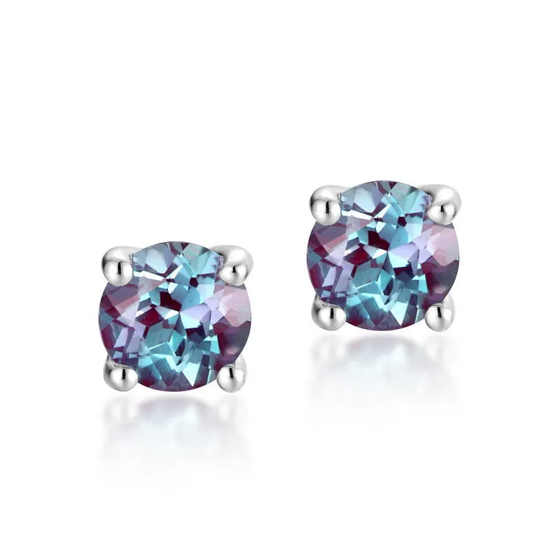 A pair of simple geometric Alexander stone ear studs in 925 silver with a round element, in cultivate Alexandrite colour.