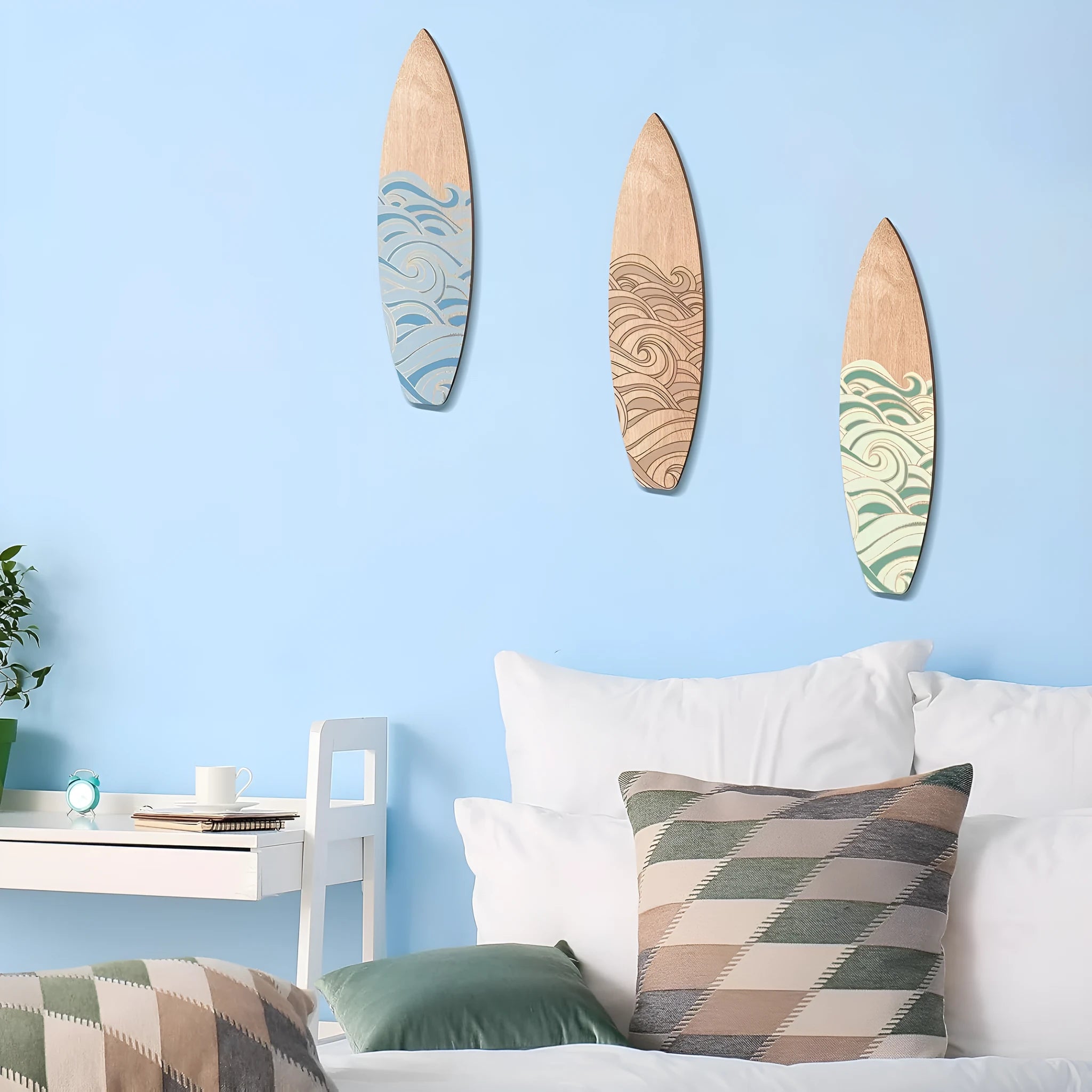 Three wooden surfboard wall decorations in natural boxwood finish, each measuring 8.5cm by 30cm