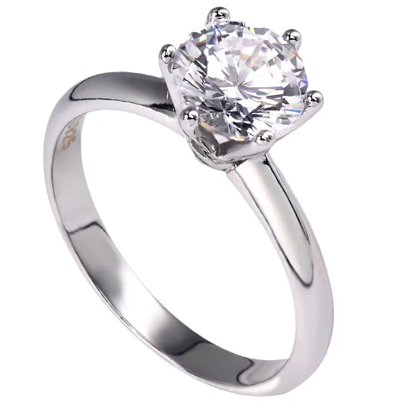 White gold plated geometric ring with a six-claw setting holding a zircon stone