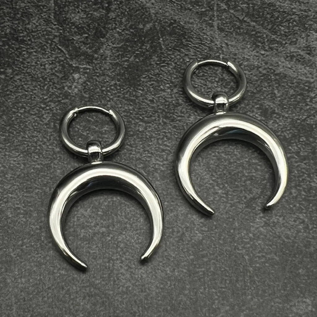 Silver big hoop earrings with a geometric shape and gothic moon design.