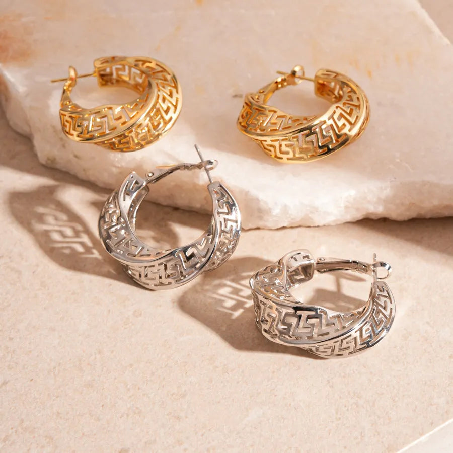 Gold and silver geometric women's hollow stud earrings with a twisted round design.