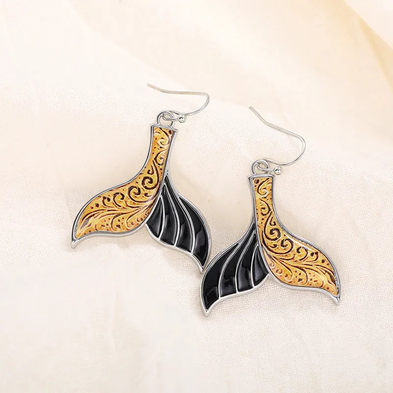 Women's retro fishtail and whale design alloy earrings in white gold colour E4143.