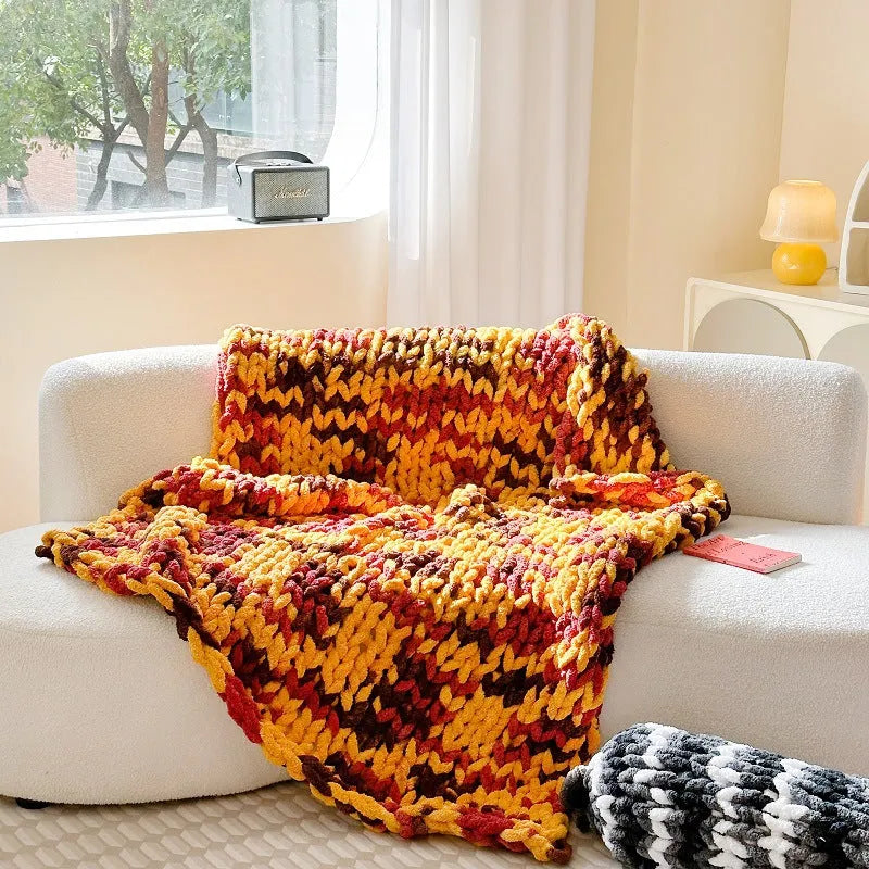 Handmade thick striped chenille winter blanket on a bed, showing caramel mango colour and 130x170cm size.